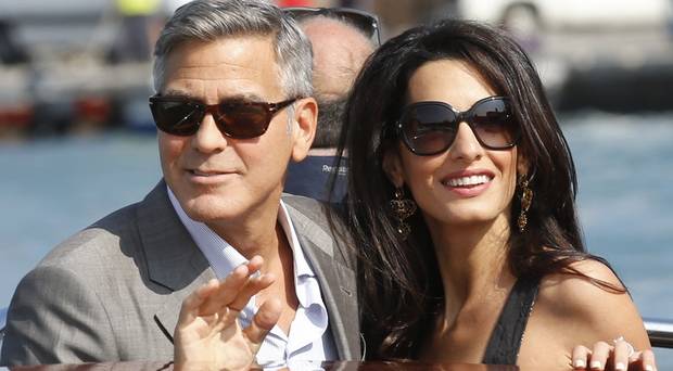 O ator George Clooney, 53, e a advogada Amal